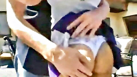 Tanned cheerleader's curvy big ass exposed as hand pulls white panties aside outdoors