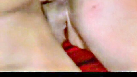 Eve Laurence close-up sensual tease in red lingerie, neck exposed