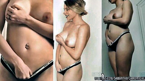 Blonde with perky tits and navel piercing pulls down black panties teasing toned belly