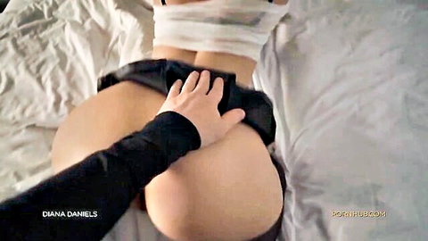 Hand groping exposed big juicy ass of curvy woman with skirt hiked up on bed