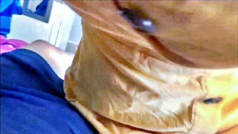 Tanned woman's neck in wrinkled orange collar with purple bra strap and blue hand nearby