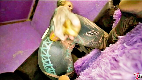 Tattooed skinny babe inserts yellow curved dildo into gaping wet pussy solo
