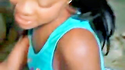 Close-up of black amateur woman in teal tank top, sultry expression