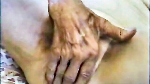 Elderly man's wrinkled hands gripping Enedina's thigh intimately