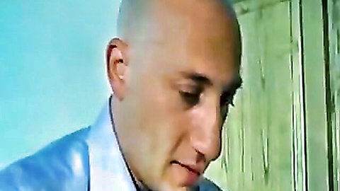 Bald stud in blue shirt staring intensely in Valentine Demy's anal scene