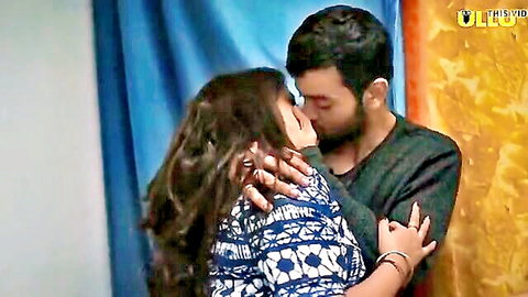Indian couple sharing a passionate kiss in an intimate embrace