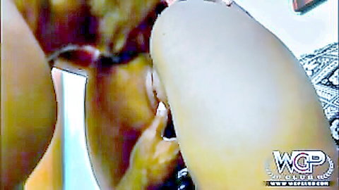 Black man's fingers deeply inserted into busty white slut's shaved pink pussy closeup