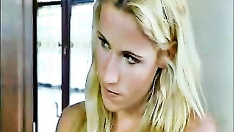 Stunning 30s Italian blonde with intense gaze, topless close-up