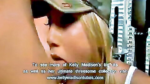 Blonde Kelly Madison teases massive tits in tight tank top and camo hat