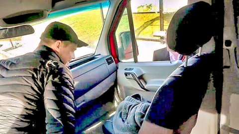 Young guy in black jacket fingers mature woman's exposed crotch in open van door