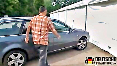 Plaid shirt man walks to gray Audi wagon in outdoor public parking for amateur couple sex