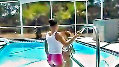 Brunette babe in tight pink shorts and white tank climbing pool steps outdoors teasing ass