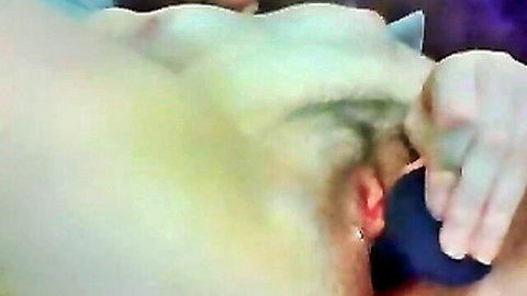 Hairy pussy penetrated by blue dildo in closeup solo masturbation