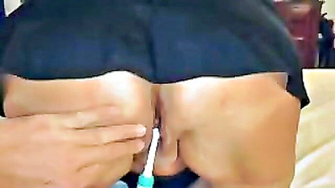 Amateur wife Daniell inserts toothbrush in wet pussy closeup