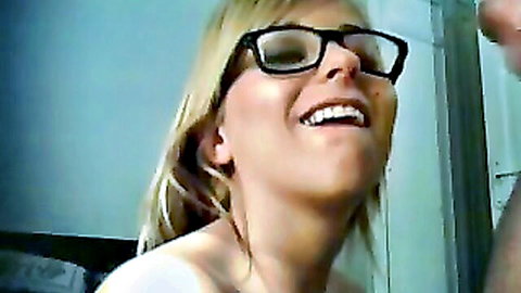 Blonde glasses babe smiles with thick cumshot dripping on face and lenses