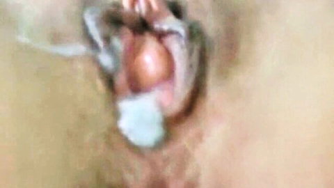 Closeup of gaping wet pussy filled with thick white cum creampie dripping out