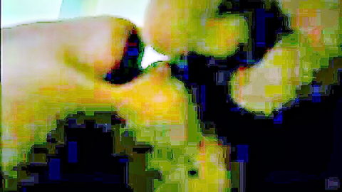Blurry close-up of East Asian babe and boyfriend kissing intensely