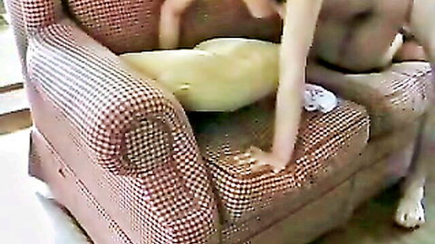 Asian amateur fucked hard doggy style on red armchair with cock deep in pussy
