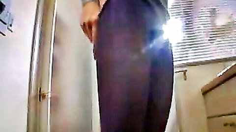 Curvy woman pulls down tight purple leggings exposing bare juicy ass cheeks from behind in bathroom