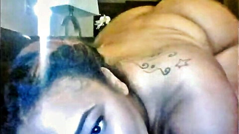 Ebony BBW flaunts massive bare ass and curves lying on side looking back seductively