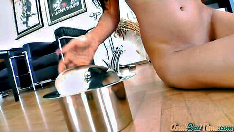 Petite brunette teen with small tits spreads shaved pussy and ass holding shiny metal pot solo