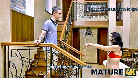 Mature beauty in red bikini teases stepson on staircase