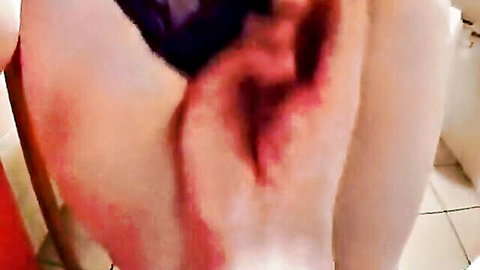 Close-up of wet pink pussy in black lingerie, solo tease