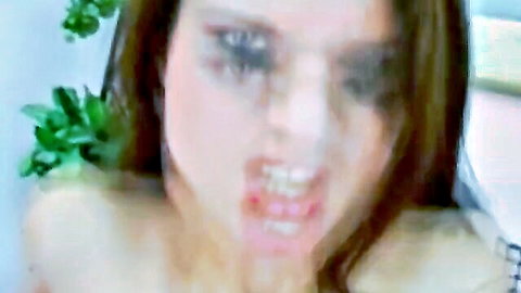 Intense close-up of European brunette mid-blowjob ecstasy