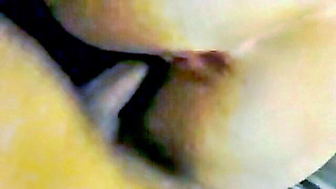 Belinda close-up fucking her shaved pussy with toy, big tits exposed