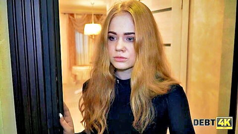 Sad blonde debtor in black top confronted at door
