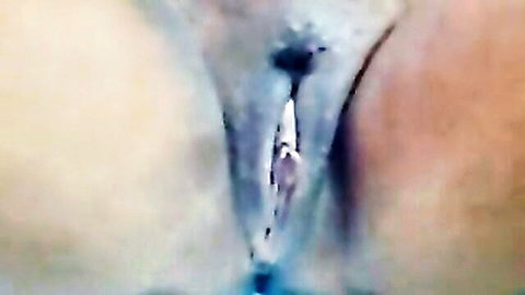 Close-up of Asian woman's wet pussy with toy insertion in live cam show