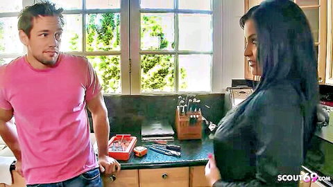 Big boobs mature stepmom in black top seduces young guy in kitchen