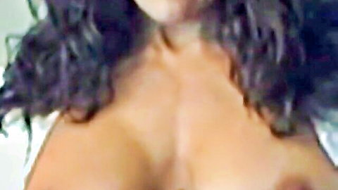Nena Cortes hot MILF topless with big breasts and curly hair