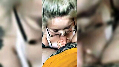 Tattooed blonde with glasses performing intense blowjob, craving cumshot close-up