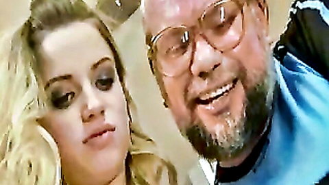 Blonde teen smiling close-up with bearded grandpa in casual pose