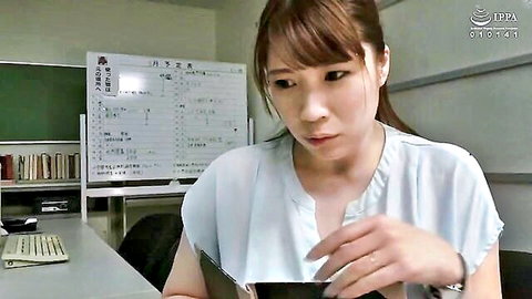 Busty Asian amateur teacher in white blouse viewing phone