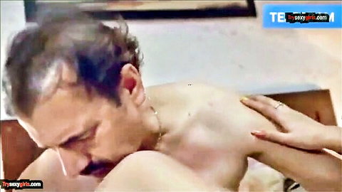 Indian man shirtless with woman's hand on chest in hardcore intimate scene