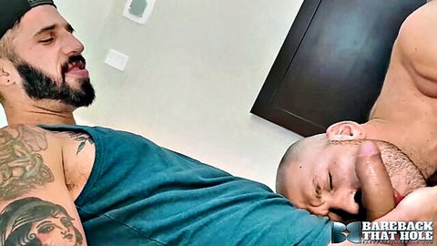 Muscular bearded men in bareback gay anal sex on all fours