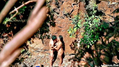Nude Indian couple passionately kissing embrace in jungle rocks bare asses exposed