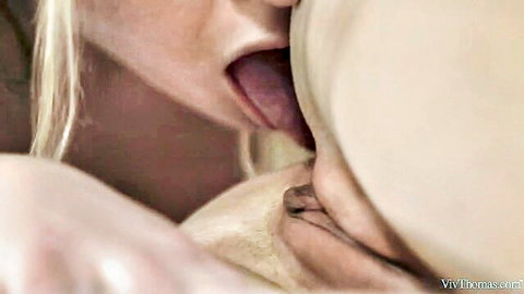 Blonde lesbian eagerly performs cunnilingus on partner's pussy