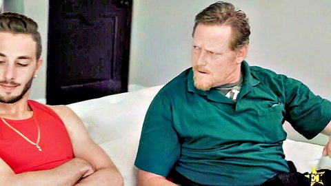 Twink and daddy duo on couch in tense tease from Her Strange Addiction series