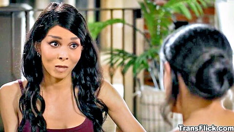 TS Valeria Atreides in red tank top talking intimately with Penny Barber