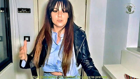 Brunette Spanish woman in leather jacket and cropped shirt teasing