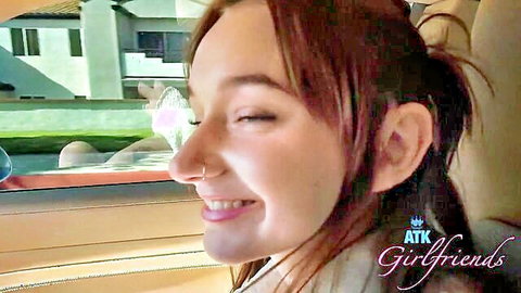 Cute redhead teen girlfriend smiling eyes closed in car POV teasing
