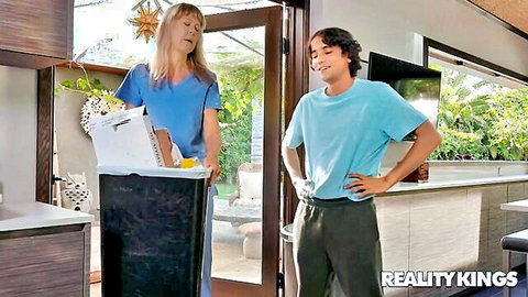 Blonde MILF in nurse scrubs tosses papers in trash as smirking stepson eyes her hungrily