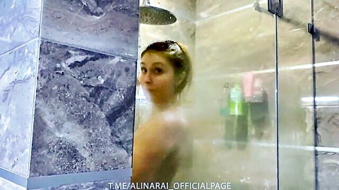 Nude blonde stepmom in steamy shower, glancing back seductively