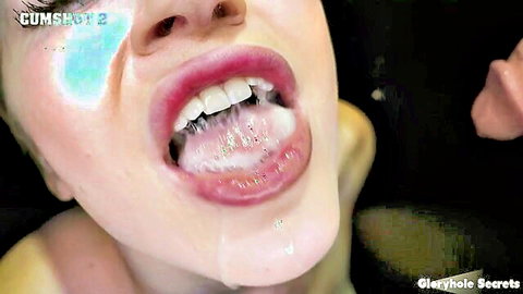 Blonde babe's open mouth filled with thick cum on tongue and teeth after gloryhole blowjob