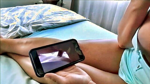Brianna Beach as stepmom holding phone watching porn with son in bed