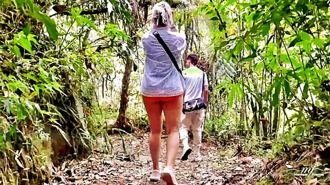 Curvy blonde MILF in tiny orange shorts hikes jungle trail flaunting big round ass