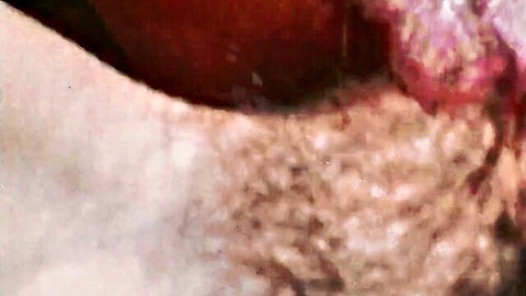 Closeup of hairy pussy with spread pink labia and pubic hair visible